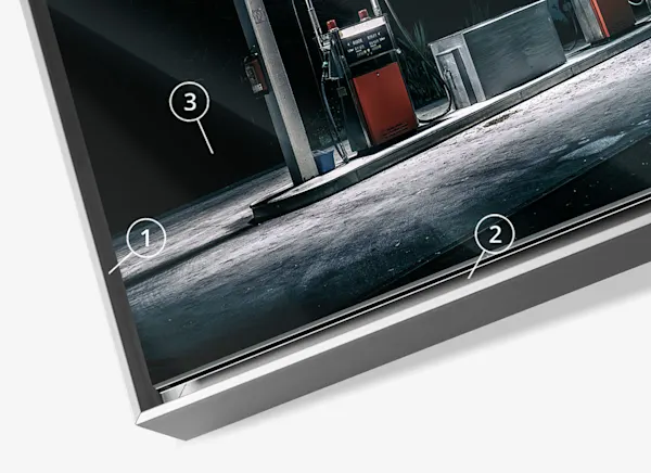 PDP | Aluminium ArtBox | Product Structure Section | Media #1 Close up of a night shot of a gas station in an Aluminium ArtBox with reference arrows 1,2 and 3.