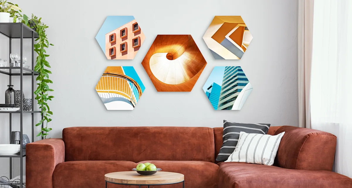 PDP | Round Format & Shapes | Big Picture Slider Section > Hexagon | Slide #3 | Media #1 5 different architectural motifs in hexagon format hang on a wall in a living room.
