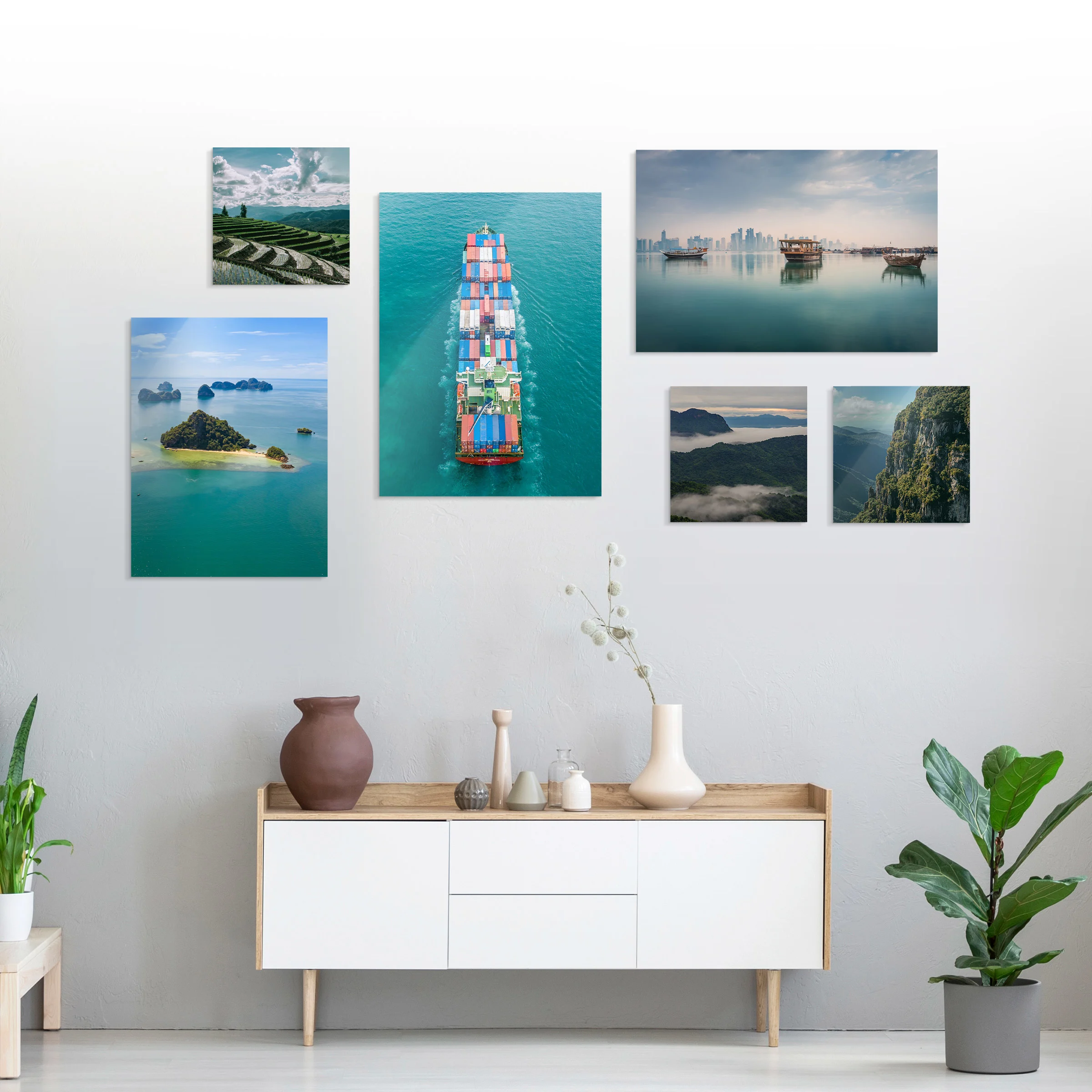 Several different motifs on a Photo Print On Aluminum Backing hang on a wall in a living room.