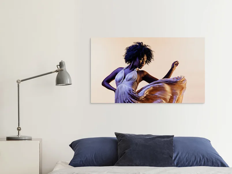 PDP | HD Metal Print | Product Selector Section | Media #3 A dancing woman on an HD Metal Print on a wall in a living room.