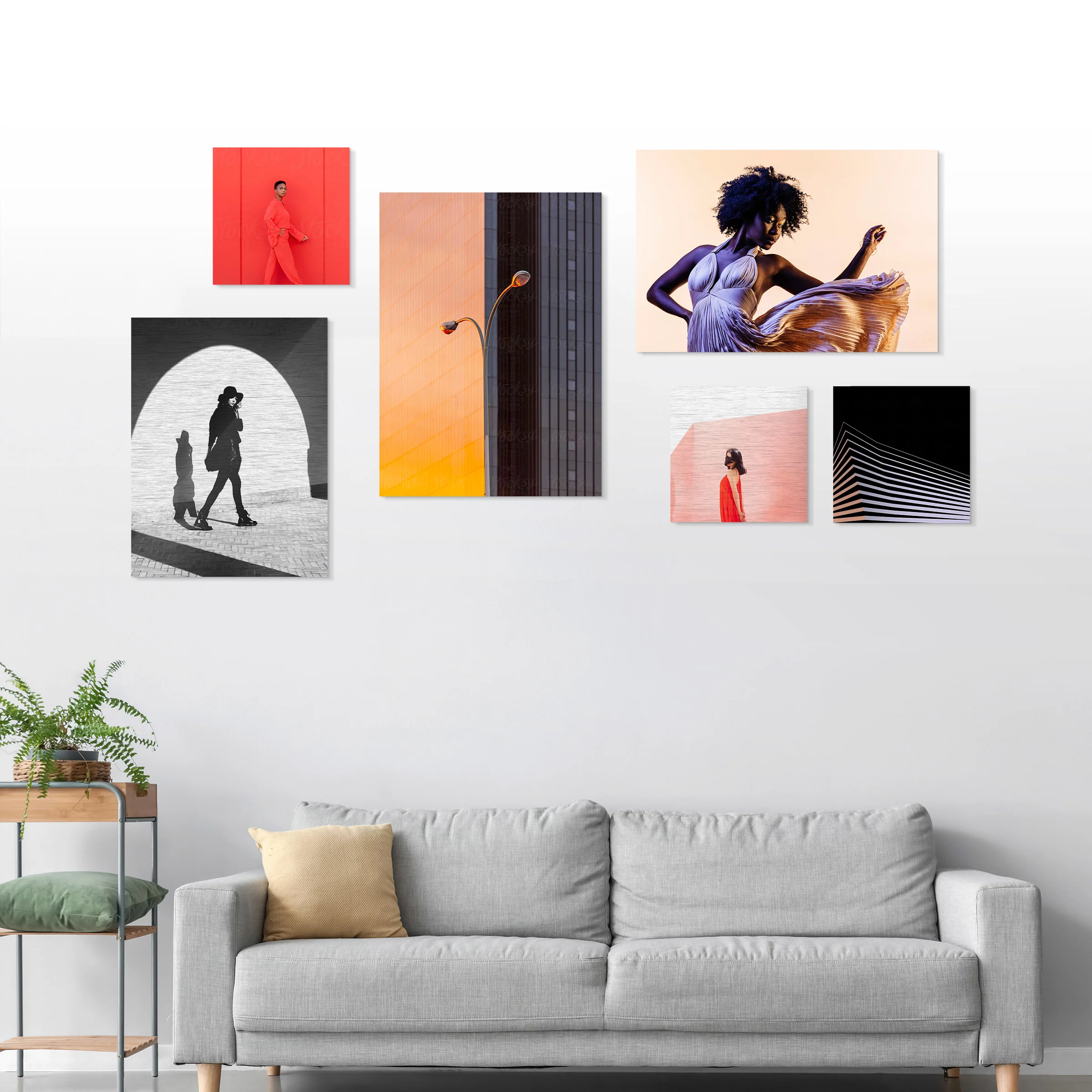 Several different motifs on an HD Metal Print hang on a wall in a living room.
