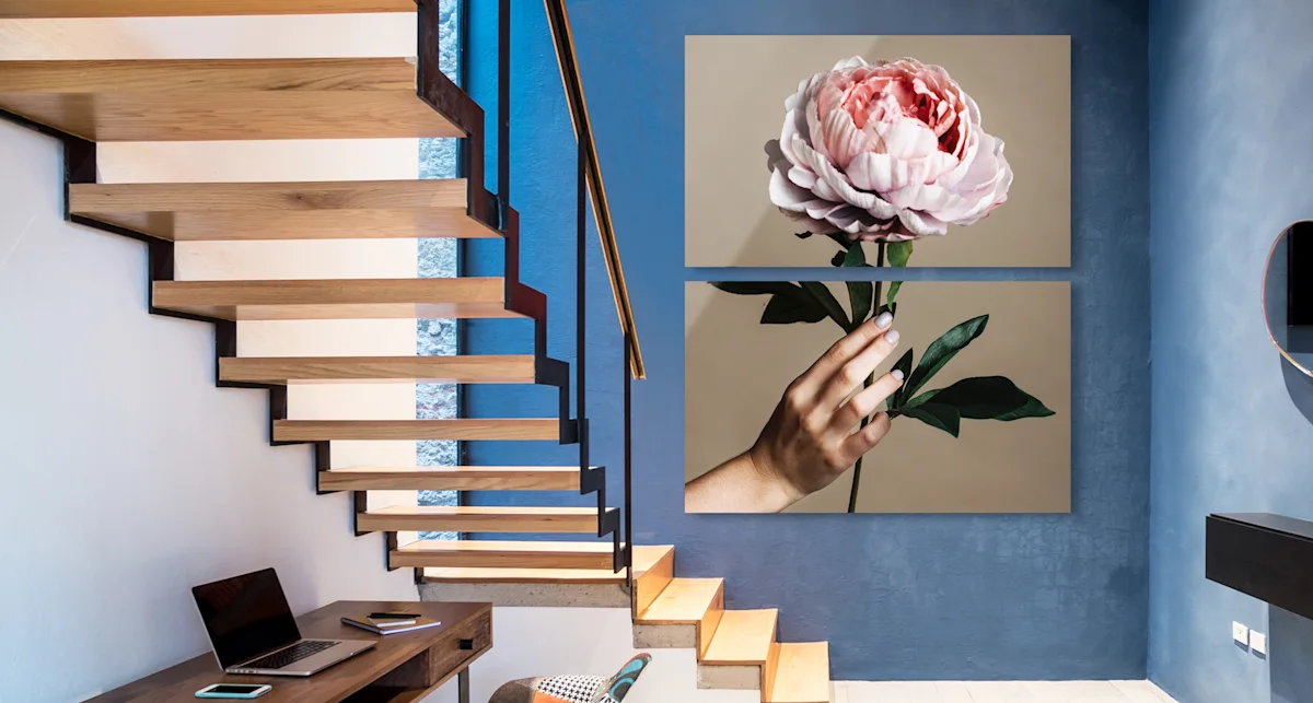 PDP | Multi Panel Wall Art | Big Picture Slider Section > Eye catcher | Slide #2 | Media #1 A woman holds a rose in her hand.. The whole picture is divided into two parts hanging vertically on the wall.