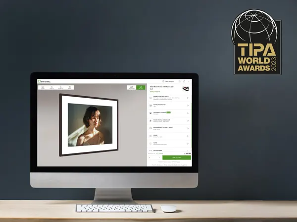 "Best Photo Lab" TIPA 2023 Desktop computer displaying WhiteWall's online photo framing interface with TIPA World Awards logo in corner