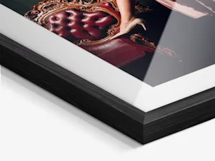 Photo in passe-partout frame Close-up of a photo in a passe-partout frame with glass and black wooden frame from WhiteWall.