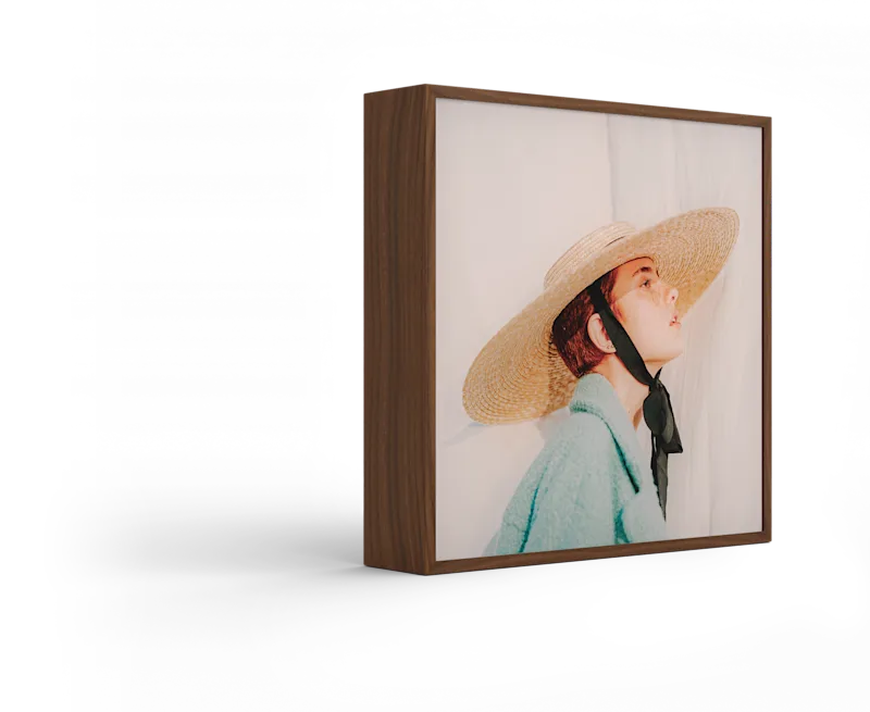 Standing ArtBox with frame color Walnut against a white background.