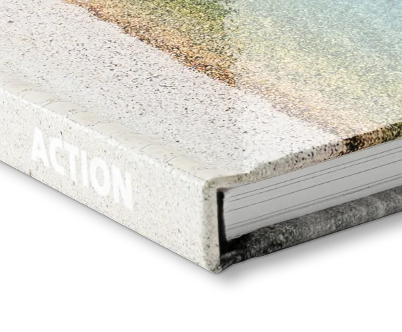 Corner view of a coffee table book with a glossy cover